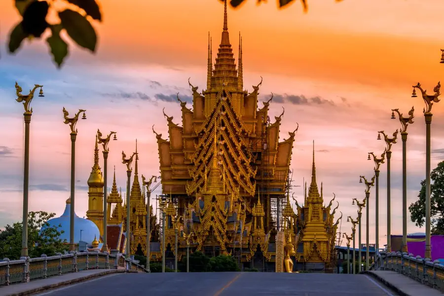 Wat Chan Tawan Tok golden roofs from Suphan Kanlaya Bridge at dusk