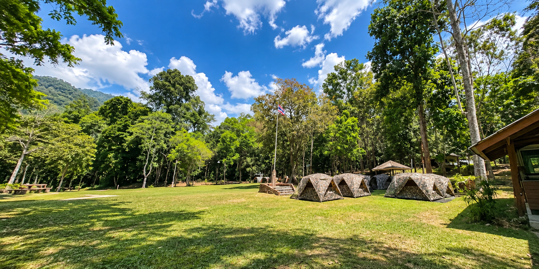 Camping lawn and forest tents at Kaeng Krung National Park headquarters, Surat Thani