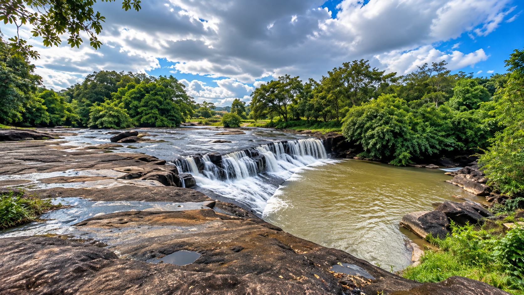 Wide sandstone cascade and pool at Kaeng Tana National Park in Ubon Ratchathani