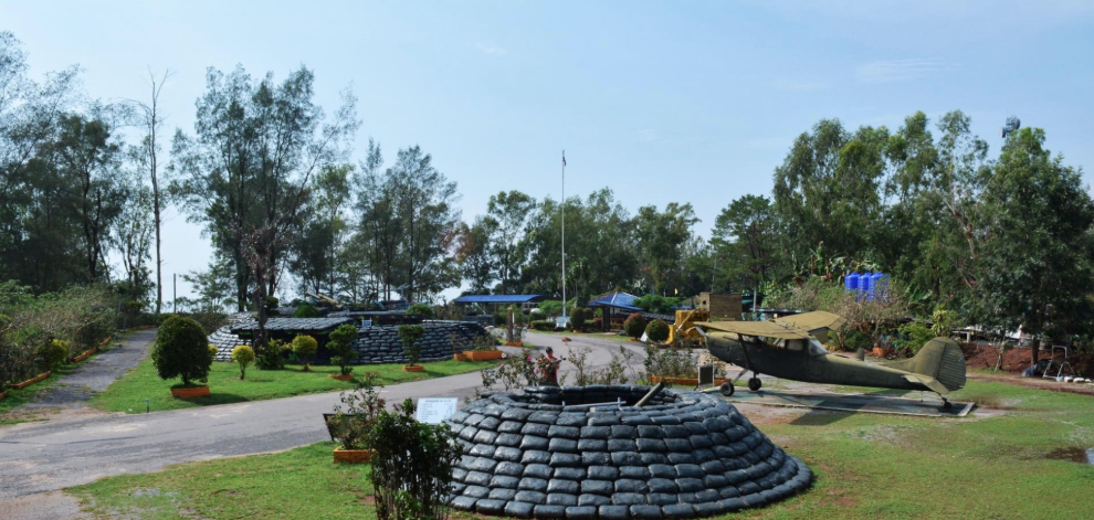 Outdoor military exhibits, bunkers and a light aircraft at Itti Base in the Khao Kho highlands