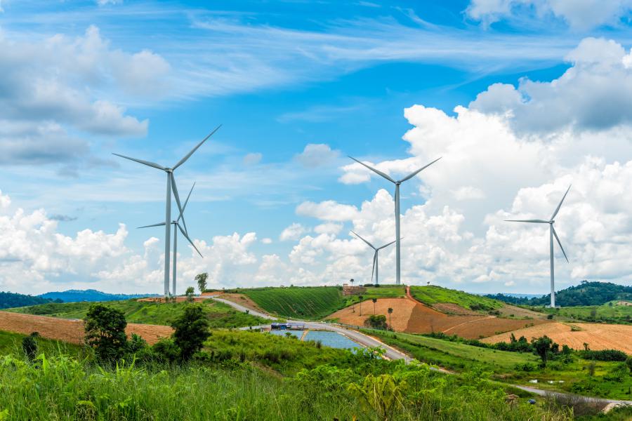 Wind turbines on rolling green hills in the wider Khao Kho highland landscape, Phetchabun