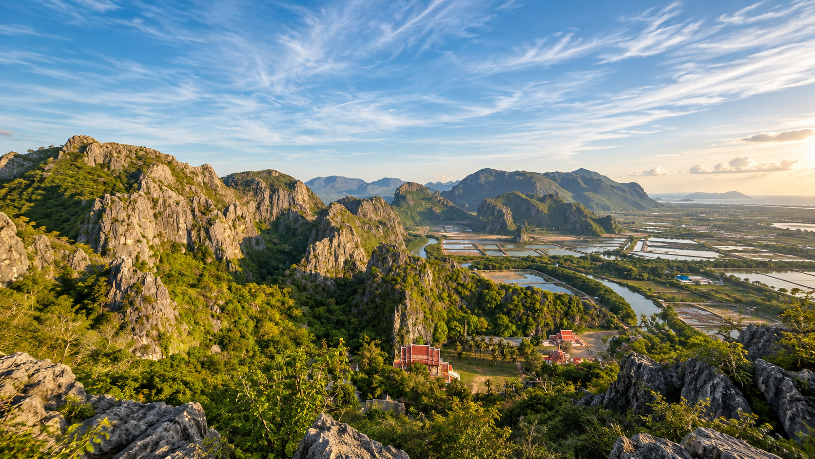Limestone karst peaks of Khao Sam Roi Yot overlooking wetlands, canals and coastal plains toward the Gulf of Thailand