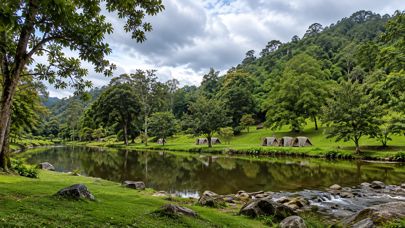 Tents beside a forest stream at Khlong Wang Chao National Park, Kamphaeng Phet