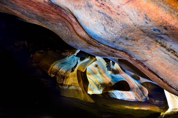 Rainbow-banded limestone walls inside Tham Sai Rung near Khun Khan National Park, Mae Sap, Chiang Mai