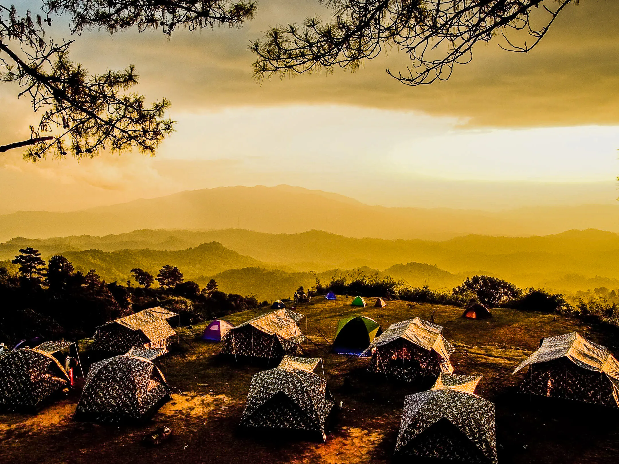 Campsite on a mountain ridge at golden hour in Nam Nao National Park