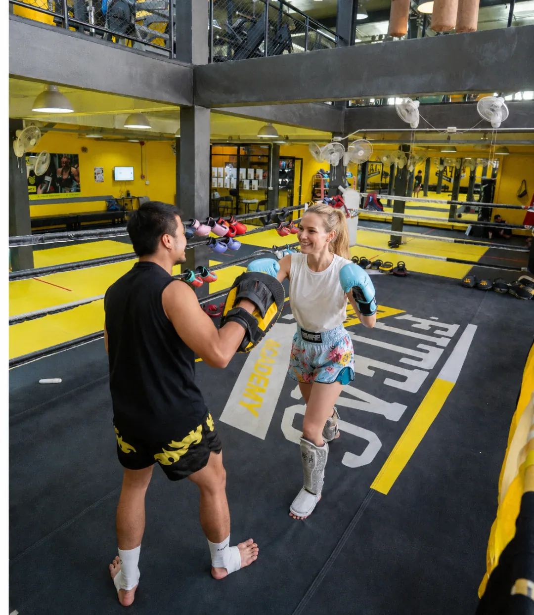 Pad work on the ring at Fitfac Muay Thai Academy in Bangkok