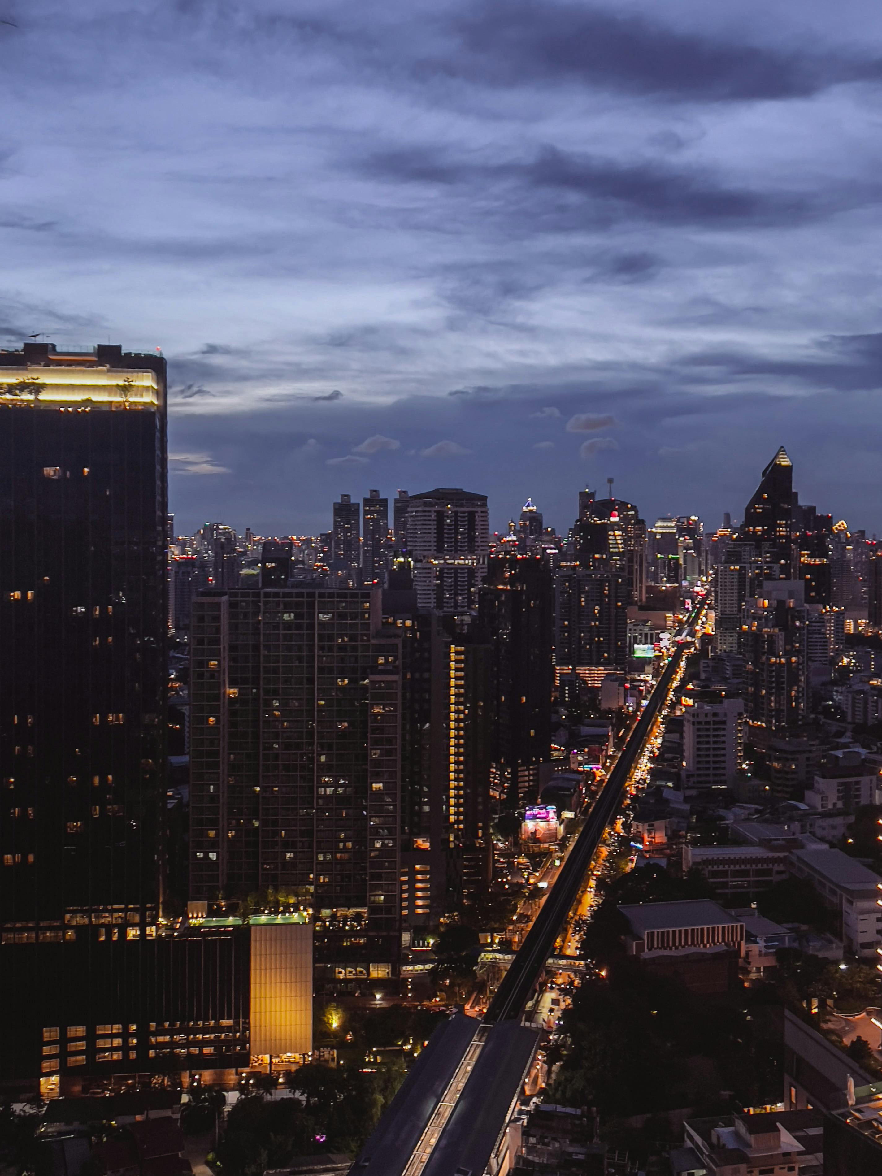 Bangkok skyline at dusk with the BTS line running through the city